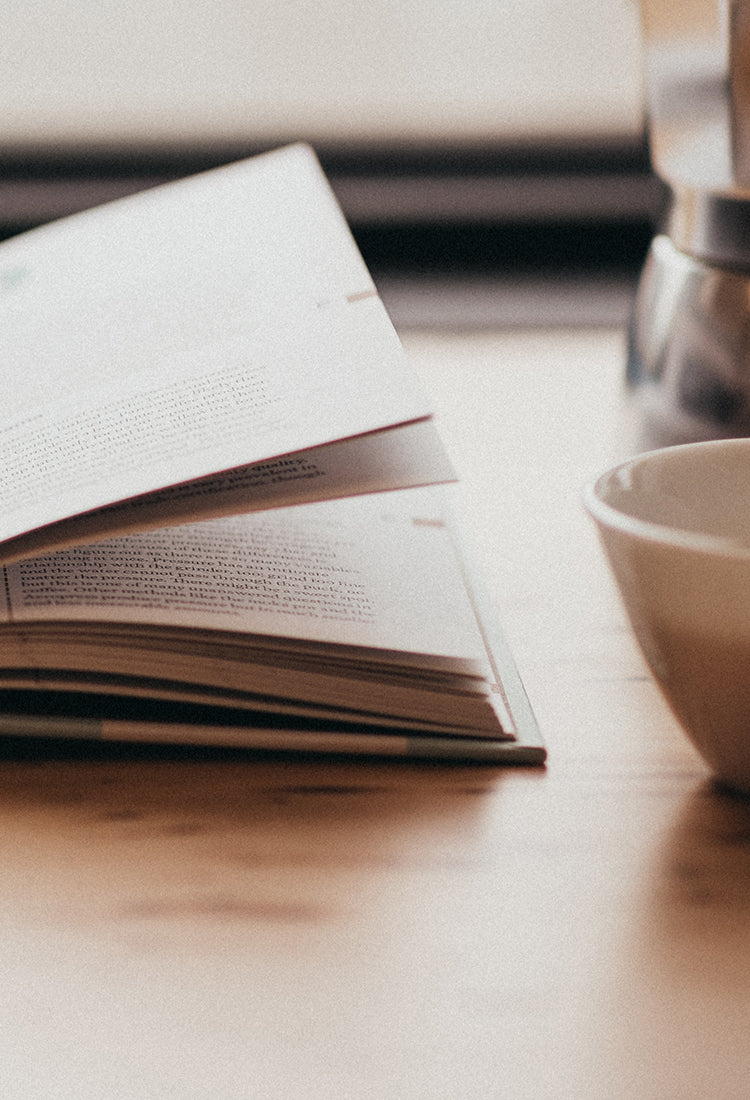 Book open with cup of coffee